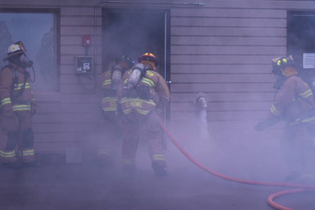 Firefighters from Fort Drum Fire and Emergency Services Division and Black River Volunteer Fire Department team up for a mutual aid nighttime live fire training event Sept. 29 at the Fort Drum Fire Department Training Center at Wheeler-Sack Army...