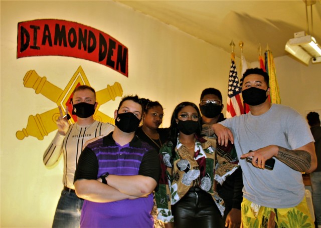 Cpl. Alexander Mason, Cpl. Thomas Perrone, Sgt. Talisha Williams, Spc. Deja Sims-Dean, Pfc. Kareem Hameed, and Spc. Christopher Alvoid pose for a photo after performing during the Spoken Word event at Fort Sill, Oklahoma.