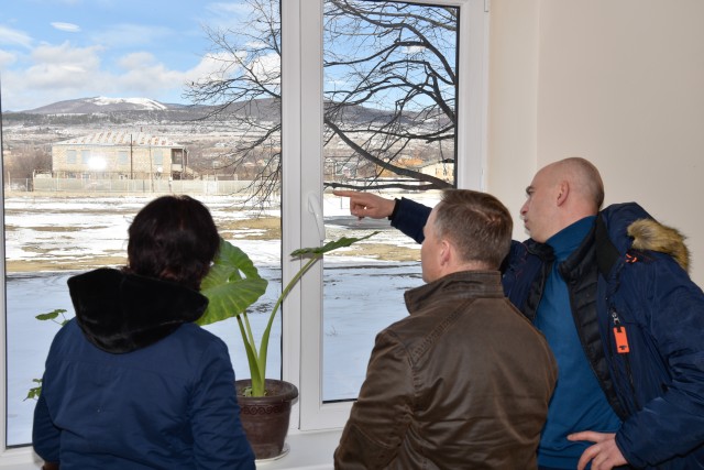 U.S. Army Corps of Engineers (USACE) employee Levan Imedadze (right) points out exterior features of the recently renovated Kveshi School to USACE leaders during a site visit to Tbilisi, Georgia, Jan. 25, 2020. (U.S. Army Photo by Christopher...