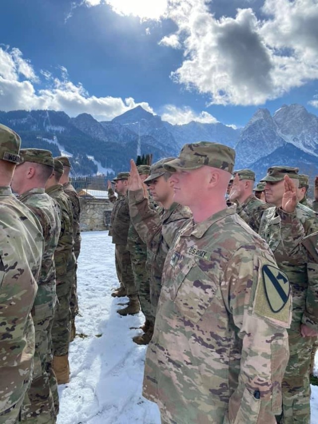 Soldiers from 1st Battalion, 8th Cavalry Regiment, 2nd Armored Brigade Combat Team, re-enlist Feb. 28, in Garmisch, Germany. Headquarters, Department of the Army announced Oct. 5 that the 1st Cavalry Division placed number one in the Army in...