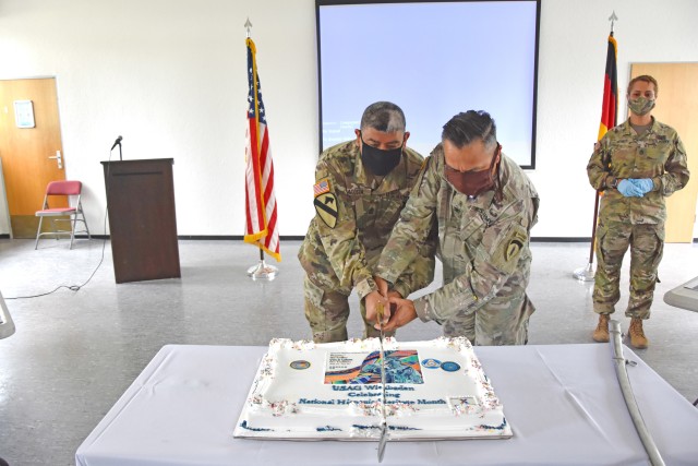 WIESBADEN, Germany - Col. Samuel Ybarra and Sgt. Maj. Francisco Acosta cut a cake following the U.S. Army Garrison Wiesbaden Hispanic Heritage Month observance Sept. 30 at the Clay Kaserne Chapel.