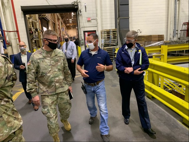 Brig. Gen. Darren Werner (left), commanding general Tank-automotive and Armaments Command, and Timothy Goddette (right), Program Executive Officer Combat Support and Combat Service Support, tour the facilities at Rock Island Arsenal Joint...