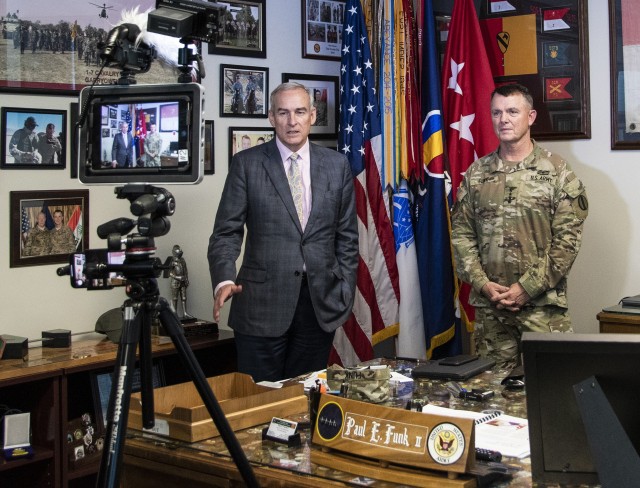 Dr. E. Casey Wardynski, Assistant Secretary of the Army for Manpower and Reserve Affairs (left), along with Gen. Paul E. Funk II, Commanding General, U.S. Army Training and Doctrine Command, record a public service announcement prior to a...