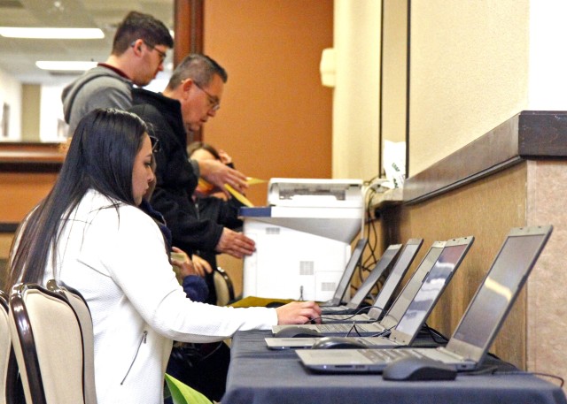 Military spouses and Soldiers transitioning out of the service participate in a job fair, hosted by the Fort Bliss Army Community Service, in Texas, Feb. 13, 2020.