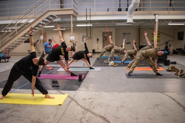 Soldiers use their lunchtime to take advantage of a Holistic Health and Fitness combat mobility yoga session Feb. 26, 2020, at the 5th Battalion, 3rd Field Artillery headquarters, JBLM, Wash. Yoga sessions are designed to improve overall mental...