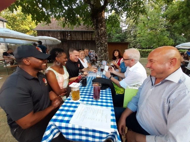 The leaders of the Regimental Support Squadron, 2d Cavalry Regiment, and its partner town of Hahnbach, Germany converse at the Frohnberg restaurant near Hahnbach, Germany, Aug. 12, 2020. Their meeting marked the first event between RSS and Hahnbach since the squadron's change of command ceremony in Vilseck, Germany, July 20, 2020.