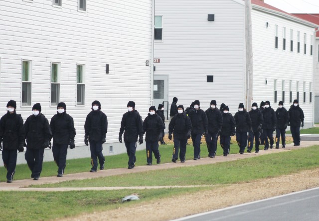 U.S. Navy recruits walk to their barracks Oct. 1, 2020, at Fort McCoy, Wis. The Navy’s Recruit Training Command (RTC) of Great Lakes, Ill., worked with the Army at Fort McCoy so the post could serve as a restriction-of-movement (ROM) site for...