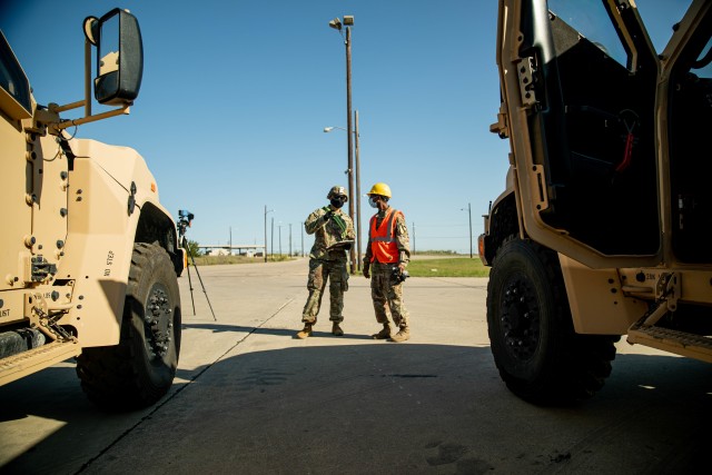 2nd Lt. Brandon Garcia (left) and Staff Sgt. Earnie Alexander (right), both with 3rd Armored Brigade Combat Team (3ABCT), 1st Cavalry Division, conduct mobility operations in preparation of receiving the new Joint Light Tactical Vehicles (JLTVs) at the rail operations center, Fort Hood, Texas, Oct. 02, 2020. The JLTV is set to partly replace a portion of within 3ABCT. With modernization comes significant enhancements such as a bigger payload, better occupant survivability, and even an all-terrain suspension system. (U.S. Army photo taken by Sgt. Calab Franklin)