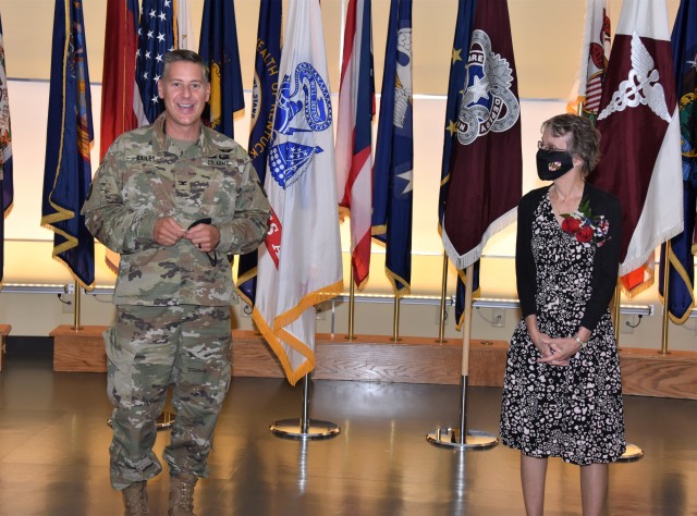 Col. John “Ryan” Bailey, commander of the U.S. Army Medical Materiel Agency, recognizes Linda Foltz for her 46 years of civilian service to the agency during a retirement ceremony Sept. 30 at Fort Detrick, Maryland.