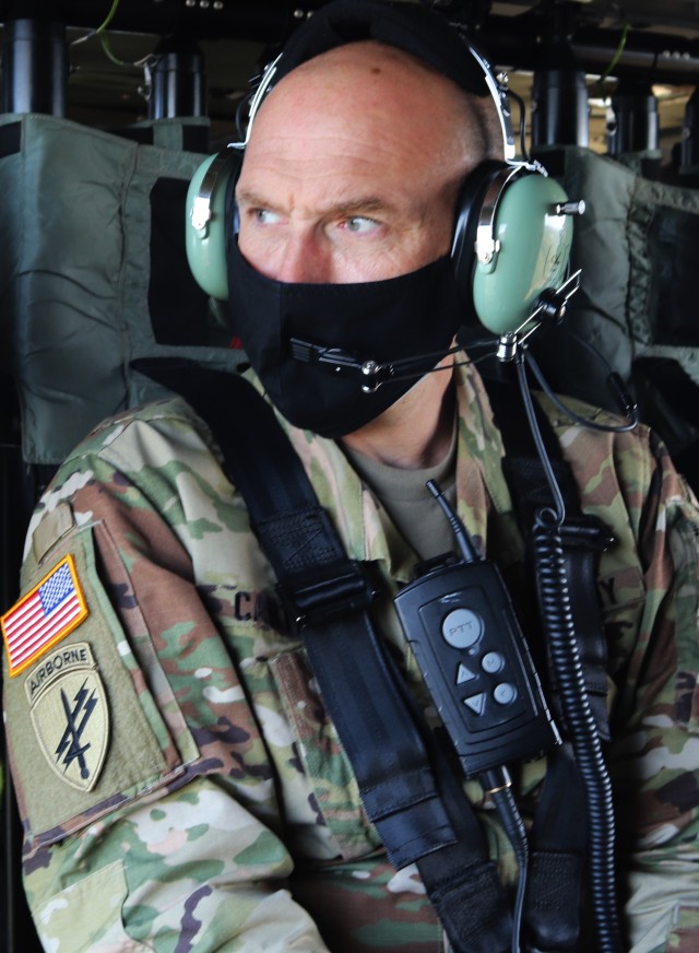 Fort McCoy Deputy Garrison Commander Lt. Col. Alexander L. Carter observes training areas of the installation Oct. 6, 2020, while flying on a Wisconsin National Guard UH-60 Black Hawk helicopter over the installation. Carter became the garrison...