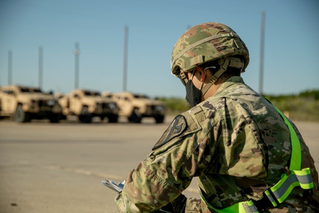 2nd Lt. Brandon Garcia, 3rd Battalion, 8th Cavalry Regiment, 3rd Armored Brigade Combat Team (3ABCT), 1st Cavalry Division, take count of newly received Joint Light Tactical Vehicles (JLTVs) at the rail operations center, Fort Hood, Texas, Oct....