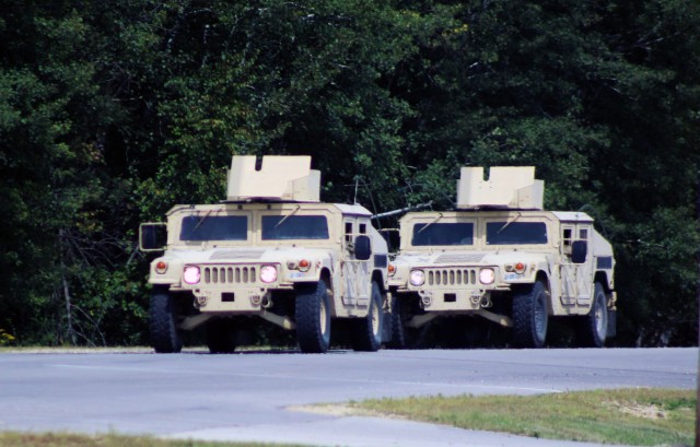 Soldiers at Fort McCoy, Wis., for training operate Humvees in a convoy Aug. 27, 2020, at the installation. Thousands of service members completed training at Fort McCoy after training resumed with safety protocols for the COVID-19 pandemic were...