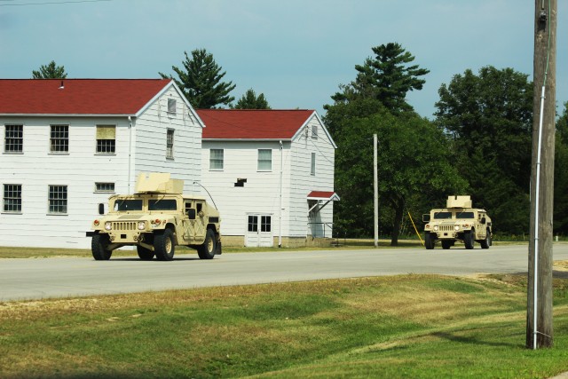 Soldiers at Fort McCoy, Wis., for training operate Humvees in a convoy Aug. 27, 2020, at the installation. Thousands of service members completed training at Fort McCoy after training resumed with safety protocols for the COVID-19 pandemic were...