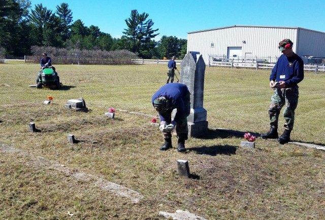 Wisconsin Challenge Academy cadets help beautify a family cemetery just outside the cantonment area Sept. 2, 2020, at Fort McCoy, Wis. The Challenge Academy, a Fort McCoy tenant organization, offers youth the opportunity to change the direction of their lives and develop the strength of character and life skills necessary to become successful, responsible citizens. The program begins with a 5 1/2-month residential phase, followed by a one-year, post-residential phase. (Photo courtesy of the Wisconsin Challenge Academy staff.)