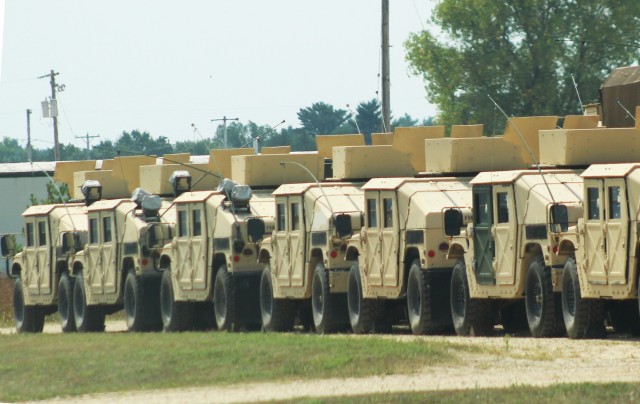Military vehicles are staged for training operations Aug. 27, 2020, at Fort McCoy, Wis. Thousands of service members completed training at Fort McCoy after training resumed with safety protocols for the COVID-19 pandemic were put in place. (U.S....