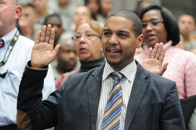 Army civilians with 5th Signal Command reaffirm their oath of office during the Operation Solemn Promise annual commemoration ceremony in Wiesbaden, Germany, Nov. 16, 2012. Civilian professional development forums will provide updates and vital...