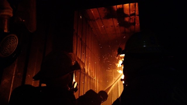 Col. Rhett Taylor, Fort Sill Garrison commander, extinguishes a fire Oct. 2, 2020, alongside Command Sgt. Maj. Russell Blackwell, Garrison CSM. Both described the science and technique firefighters use to put out a fire as impressive.