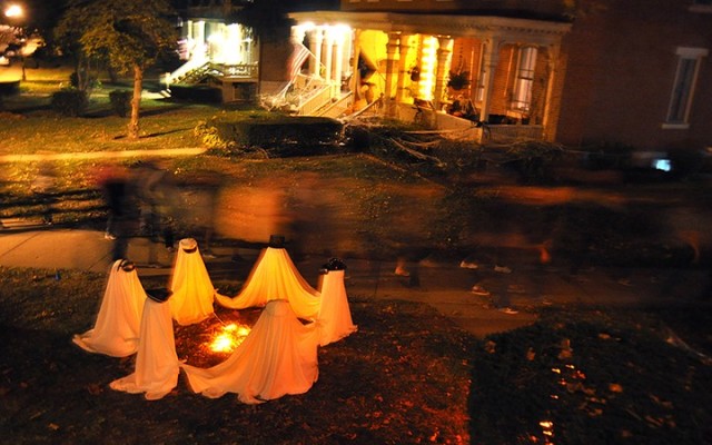 Friends of the Frontier Army Museum Haunted Tour participants pass Halloween decorations on the front lawn of the Rookery as they head back to the old U.S. Disciplinary Barracks after hearing tales from storytellers at several stops Oct. 22, 2016....