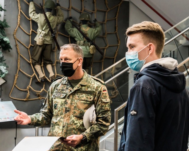 WIESBADEN, Germany – U.S. Army Europe Chief of Staff Brig. Gen. Jared Sembritzki presented Simon Krieger-Pleus, a German national, a certificate of appreciation and coin Oct. 2 at U.S. Army Garrison Wiesbaden for his discovery and return of a U.S. Soldier’s World War II dog tags.