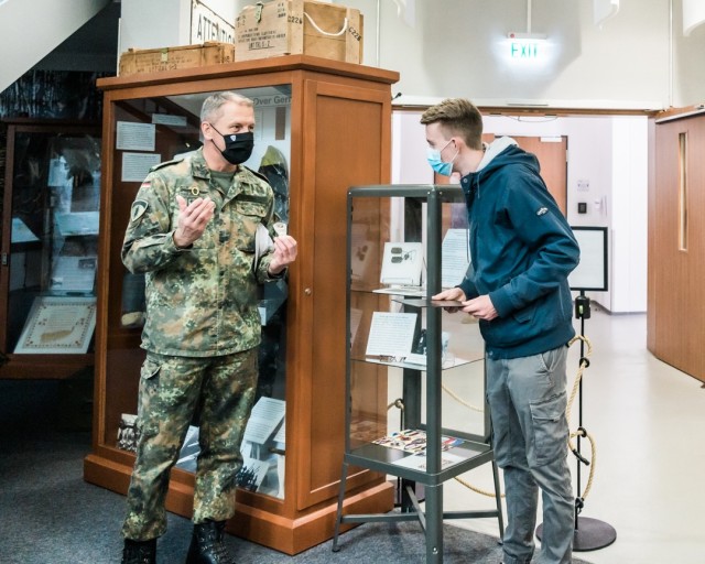 WIESBADEN, Germany – U.S. Army Europe Chief of Staff Brig. Gen. Jared Sembritzki presented Simon Krieger-Pleus, a German national, a certificate of appreciation and coin Oct. 2 at U.S. Army Garrison Wiesbaden for his discovery and return of a...