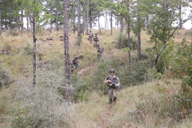 Soldiers from 1st Brigade Combat Team, 101st Airborne Division (Air Assault), walk through the terrain during patrolling operations Sept. 28 at Joint Readiness Training Center-Fort Polk, Louisiana. (U.S. Army photo by JRTC Media Team)