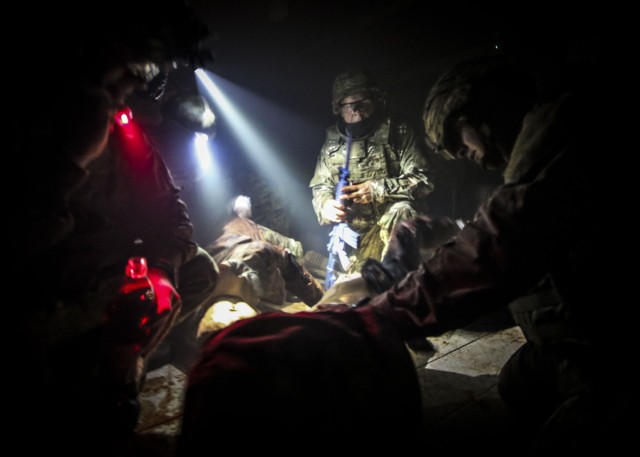 Service Members assess a simulated casualty during the Care Under Fire (CUF) portion of the International Trauma Combat Casualty Care course at Landstuhl Regional Medical Center, Sept. 30. The international course, which included Service Members...