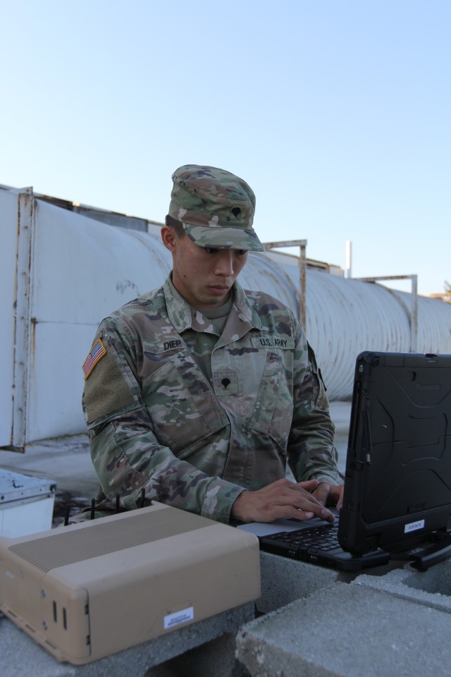 BUTLERVILLE, Ind. – Spc. Mike Diep, who hails from Los Angeles, is a cyberspace operations specialist assigned to Expeditionary CEMA (cyberspace electromagnetic activities) Team, ECT-01, 915th Cyber Warfare Battalion, participating in a Field...