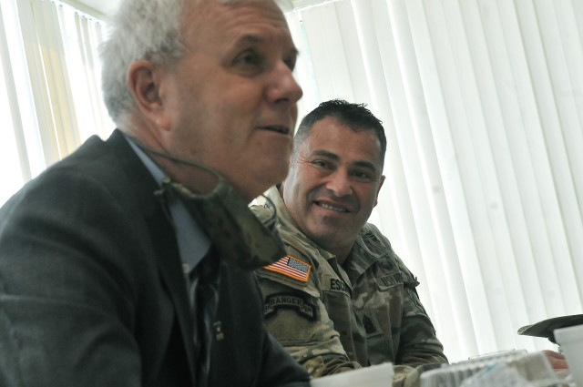 Command Sgt. Maj. Jorge Escobedo, CASCOM CSM, listens as The Honorable James McPherson, Under Secretary of the Army, converses with troops at the Samuel Sharpe Dining Facility Oct. 8. The DFAC was one of several facilities the Under Secretary...