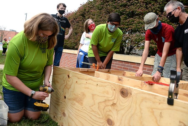 Scouts BSA Troop 166 member Carey Nestler, center, oversees construction of her Eagle Scout project by volunteers, including Troop 166 member Emily Harris, Troop 165 member John Goodman, Troop 166 member Eliza Resch, Troop 366 member Aiden Harris...