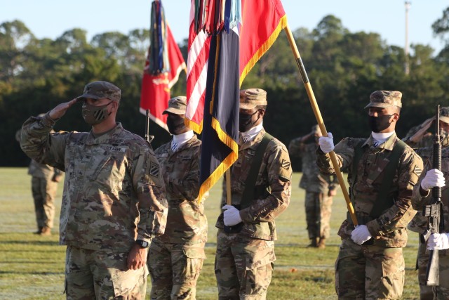 Col. Trent Upton, commander of the 1st Armored Brigade Combat Team, salutes during the national anthem during the unit’s color casing ceremony at Cottrell Field in Fort Stewart, Georgia, Oct. 1, 2020. The 1st ABCT will replace the 2nd Brigade Combat Team, 1st Infantry Division, as part of a regular rotation of forces to support the United States’ commitment to Southeast Asia partners and allies. The 1st ABCT color casing ceremony signifies the transition of the “Raider Brigade” from the mission ready actions, to embarking on their mission to deter aggression on the Korean Peninsula in coordination with the nation’s allies and partners. (U.S. Army photo by Sgt. Reva Catholic)