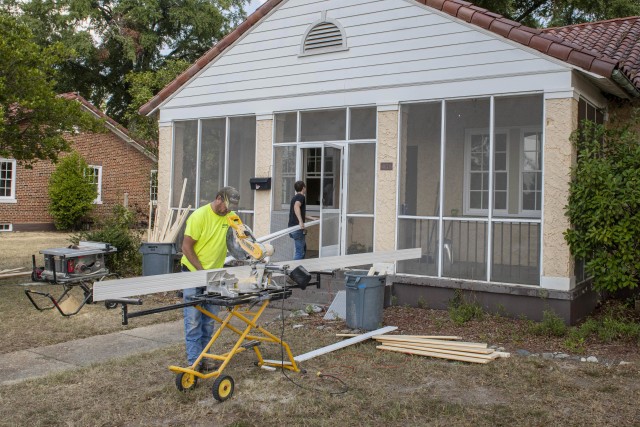 Workers install new windows at one of the historic homes on Fort Benning, Ga., Oct. 1, 2020. Modifications to these homes are part of a broader effort underway to eliminate lead-based paint hazards in these facilities.