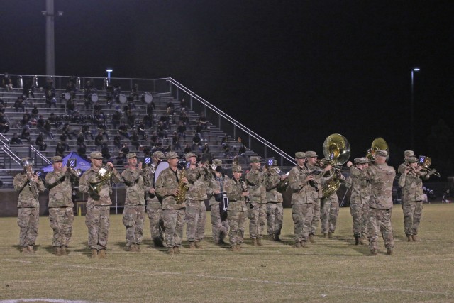 The 3rd Infantry Division band, led by Chief Warrant Officer 3 Mike Krzmarzick, perform a half-time show during a military appreciation game between Bradwell Institute and Richmond Hill High School Oct. 9, 2020, at Olvey Field, Hinesville,...