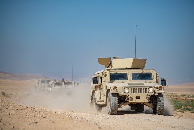 Soldiers from the 75th Field Artillery Brigade roll along a dusty desert road Oct. 5, 2020, during High Mobility Multipurpose Wheeled Vehicle convoy training. The brigade is deployed to the Middle East in support of Operation Inherent Resolve and Operation Spartan Shield.