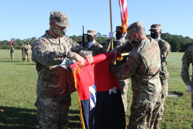 Col. Trent Upton, commander, and Command Sgt. Major Jonathan Reffeor, senior enlisted leader, 1st Armored Brigade Combat Team prepare to case the brigade colors during the unit’s color casing ceremony at Cottrell Field in Fort Stewart, Georgia, Oct. 1, 2020. The 1st ABCT will replace the 2nd Brigade Combat Team, 1st Infantry Division, as part of a regular rotation of forces to support the United States’ commitment to Southeast Asia partners and allies. The casing of the colors is a traditional ceremony held by United States Army commands, brigades and regiments. It is customary for the unit's flag, or its colors, to be properly stored prior to the unit's deployment. (U.S. Army photo by Sgt. Reva Catholic)