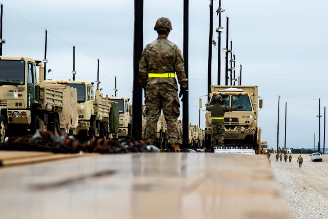 1st Cavalry Division Sustainment begins to load vehicles during rail-load operations at Fort Hood, Texas, Jan. 30, 2020. The rail-load operations are in preparation of exercise Defender-Europe 20, the deployment of a division-size combat-credible...