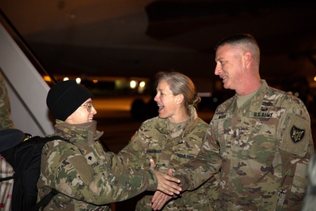 Brig. Gen. Jamelle Shawley, center, and Command Sgt. Maj. Juddiah Mooso, right, the Army Reserve Aviation Command team, greet 11th Expeditionary Combat Aviation Brigade and 244th ECAB Soldiers returning from a nine-month deployment Jan. 5, 2020,...