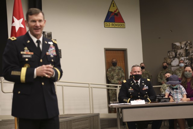 Maj. Gen. John B. Richardson IV, Deputy Commanding General, III Corps and Fort Hood, provides remarks prior to promoting Lt. Col. Bryan W. Frizzelle to the rank of Colonel in a ceremony held at 1st Armored Division Headquarters at Fort Bliss,...