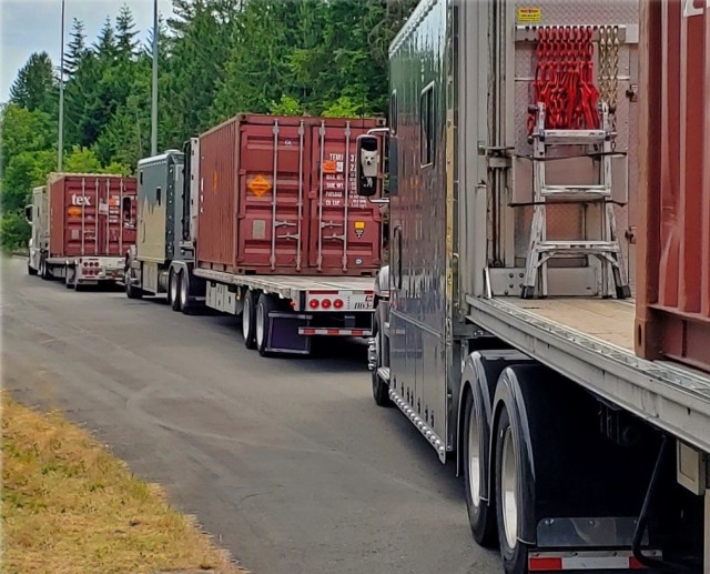 Trucks convoy to Naval Magazine Indian Island from transition yard at Kitsap Bangor.