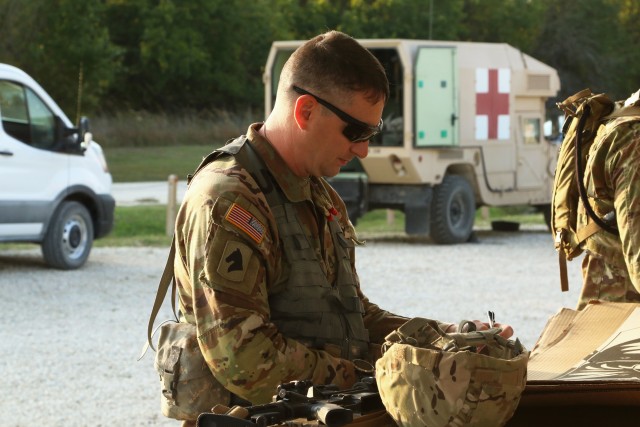 Kansas Army National Guard Staff Sgt. Joshua Briscoe, 226th Engineer Company, 891st Engineer Battalion, grades a fellow competitor’s targets by analyzing the accuracy of the shots during the Adjutant General’s Combat Marksmanship Championship Match at the Kansas Regional Training Center, Salina, Kansas, Sept. 27, 2020. Briscoe is one of 65 competitors who attended this year’s match.