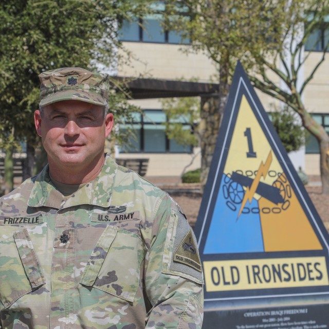 Lt. Col. Bryan W. Frizzelle poses outside 1st Armored Division Headquarters prior to his promotion ceremony Oct. 16. Frizzelle is one of 14 Lieutenant Colonels from across the U.S. Army selected to serve in a higher grade in a new Army Talent...