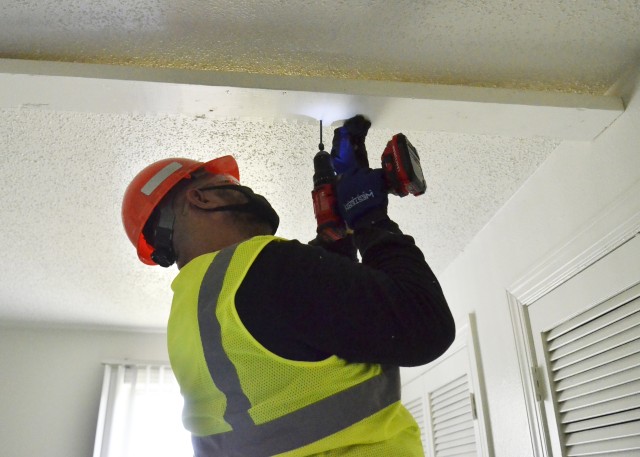 Luis Osegera, a contractor with Paragon Construction, repairs a ceiling in a home Oct. 6, in Hammond Heights, Fort Campbell. The remedial work is in response to potential ceiling failures identified in homes built in the 1960s and ’70s prior to...