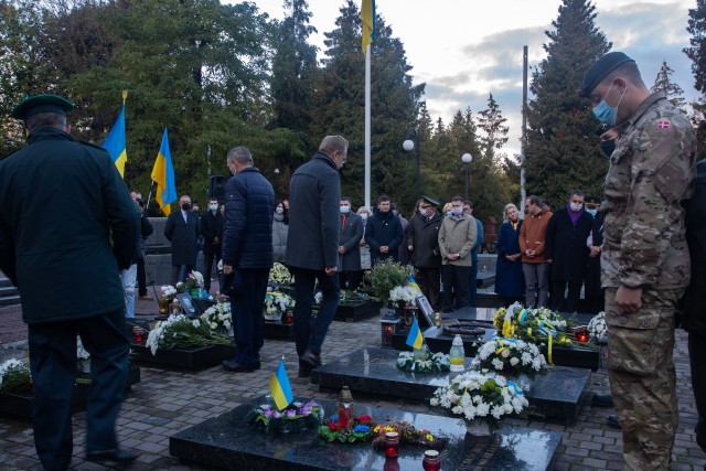 A Danish soldier pays his respects during the Defender’s Day memorial ceremony at the historical Lychakiv Cemetery in Lviv, Ukraine, Oct. 14. (Photo by U.S. Army Cpl. Shaylin Quaid, JMTG-U Public Affairs)