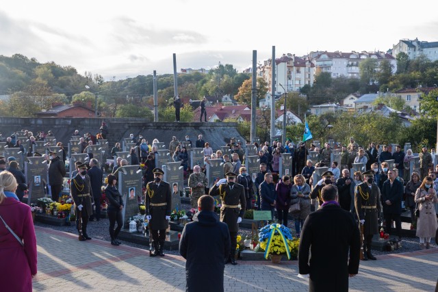 Armed Forces of Ukraine soldiers stand among attendees of the Defender’s Day memorial ceremony at the historical Lychakiv Cemetery in Lviv, Ukraine, Oct. 14. (Photo by U.S. Army Cpl. Shaylin Quaid, JMTG-U Public Affairs)