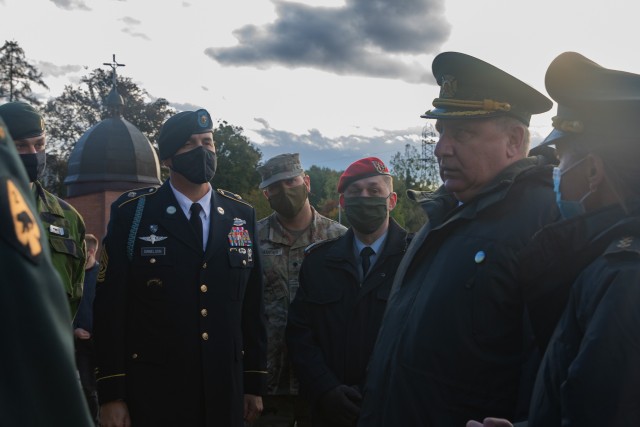Command Sgt. Maj. Douglas Danielson listens as General Pavlo Tkachuk thanks him and the other multinational partners for their attendance of the Defender’s Day memorial ceremony at the historical Lychakiv Cemetery in Lviv, Ukraine, Oct. 14....