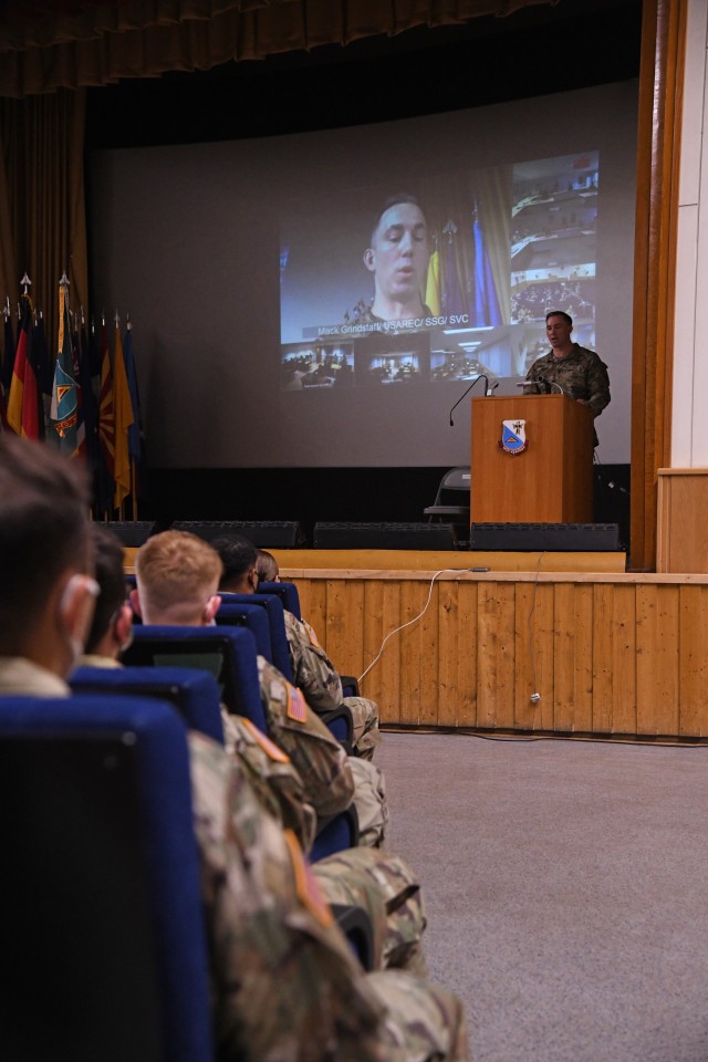 U.S. Army Command Sgt.  Maj.Michael Burke, enlisted senior adviser for the 2nd Cavalry Regiment, addresses the class of 10-20 graduates as they graduate from the 7th NCO Academy Basic Leadership Course Army Training Command at Rose Barracks Theater in Vilseck, Germany October 9, 2020 Due to COVID-19 restrictions, the course and graduation took place both in person and virtually, the majority of graduates participating virtually.  (U.S. Army photo by Kevin Sterling Payne)