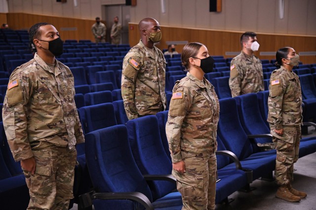 U.S. Soldiers graduate from the 7th Army Training Command's NCO Academy Basic Leadership Course as Graduate List Commanders at the Rose Barracks Theater in Vilseck, Germany, on October 9, 2020. Due to COVID-19 restrictions, the course and graduation both took place in person and virtually, with the majority of graduates participating virtually.  (U.S. Army photo by Kevin Sterling Payne)