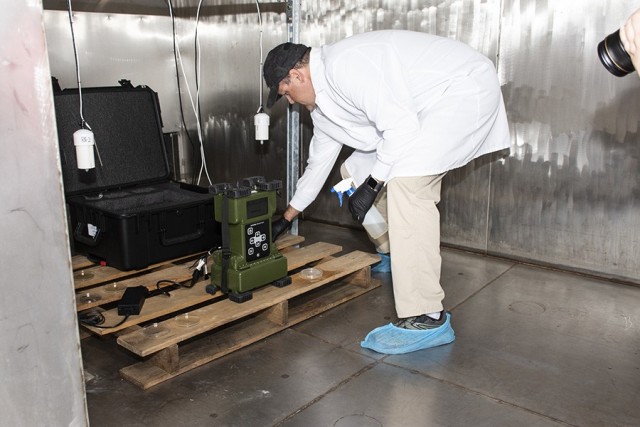 James Sorenson, a microbiologist at Dugway Proving Ground, applies fungus spores and a growth medium to the Aerosol and Vapor Chemical Agent Detector (AVCAD), where it will spend 28 days in warm, humid darkness. The test determines if AVCAD&#39;s...