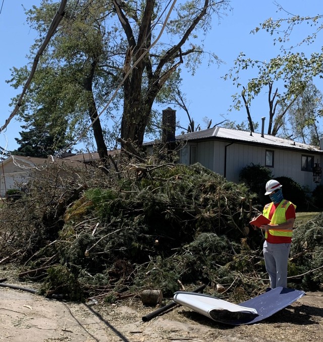 Corps of Engineers Debris Subject Matter Expert, Herb Bullock, performs a debris assessment after an intense, fast-moving windstorm, called a derecho, caused widespread damage to trees and buildings across the state of Iowa.