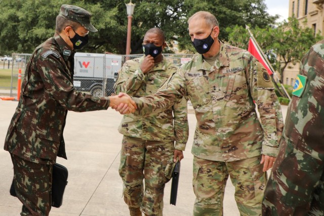 Maj. Gen. Daniel R. Walrath (right), commanding General, U.S. Army South, greets Brig. Gen. Otávio Rodrigues de Miranda Filho (left), 5th deputy chief of staff of the Brazilian Army and the head of delegation for Brazil during the U.S., Brazil...