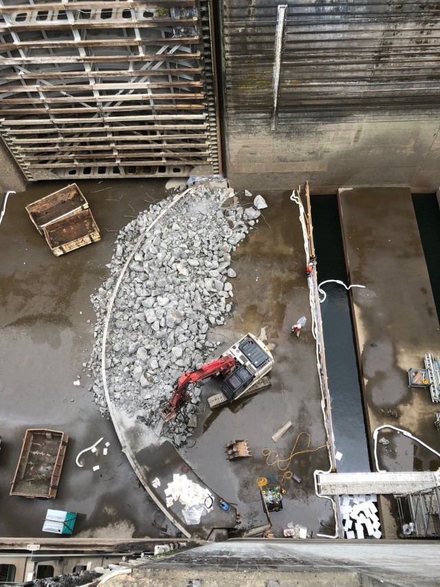 Crews demolish the damaged concrete sill to make way for a new sill on the floor of Bonneville navigation lock.